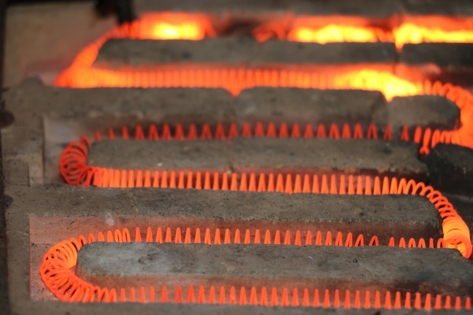Glowing heating elements inside a furnace